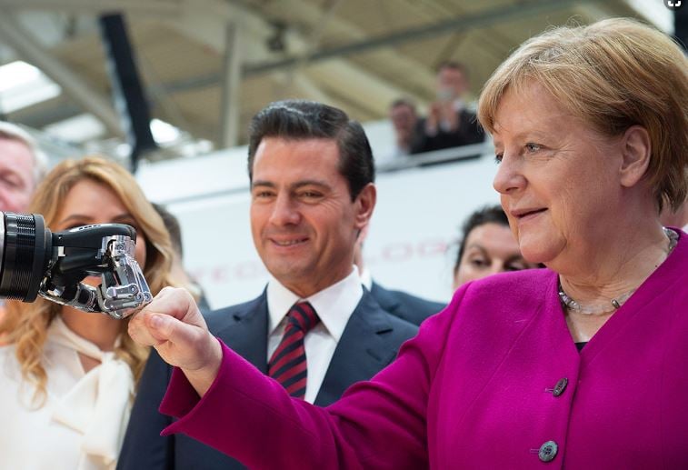 Angela Merkel greets the robot